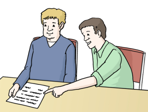 Auf dem Bild erklärt eine Person einer anderen einen Text – sie unterstützen sich beim Verstehen.