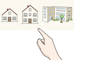 Das Bild zeigt eine Hand, die auf ein Wohnhaus zeigt – es geht um die freie Wahl, wie und wo man wohnen möchte.