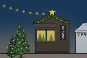 Auf dem Bild sieht man den weihnachtlich geschmückten Hofladen mit Weihnachtsbäumen.