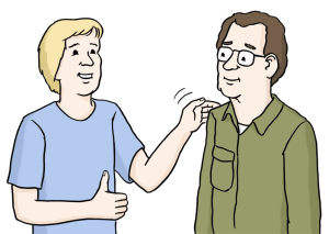 Auf dem Bild sieht man zwei Person, die eine klopft der anderen Person auf die Schulter. Als Lob.