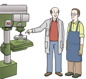 Auf dem Bild zeigt eine Person einer anderen, wie man an einer Maschine arbeitet.